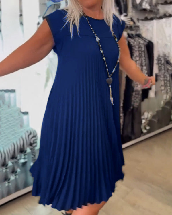 Plisserad klänning - elegant och avslappnad damklädsel