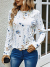 Vit långärmad t-shirt med blommönster - elegant topp för damer