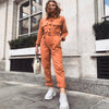 Kvinnors stiliga overall - orange utility jumpsuit med lång ärm och midjebälte