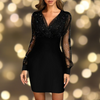 Kvinnlig festklänning med glittrande detaljer - långärmad miniklänning för speciella tillfällen
