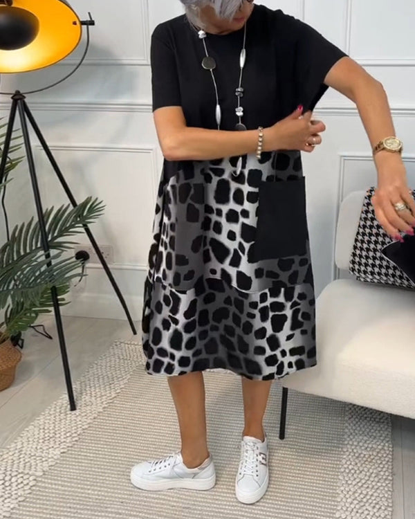 Avslappnad klänning - stilren svart och grå klänning för damer med fickor