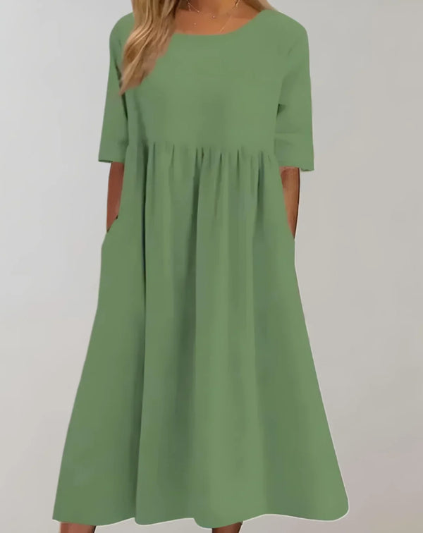 Kvinnors avslappnade bomullsklänning med fickor - elegant a-linje design för vardagsbruk