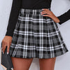 Kvinno plisserad mini kjol - trendy rutigt mönster för damer