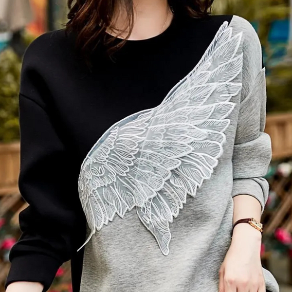 Svart premium sweatshirt - stilfull damtröja med vinge detaljer