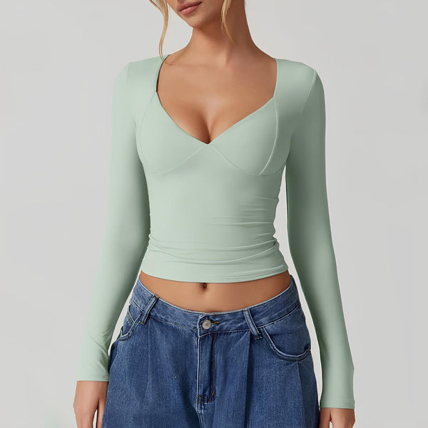 Fitted långärmad topp - elegant v-ringning för damer