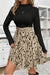 Svart a-linjeformad klänning med djurmönstrad kjol - elegant damensemble