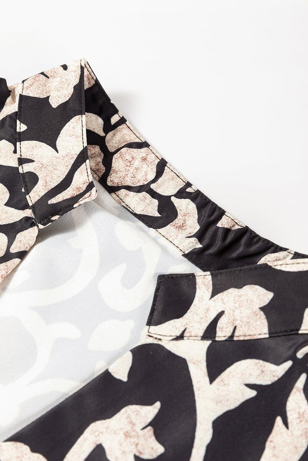 Blommig klänning - elegant svart miniklänning med vintageprint