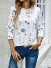 Vit långärmad t-shirt med blommönster - elegant topp för damer