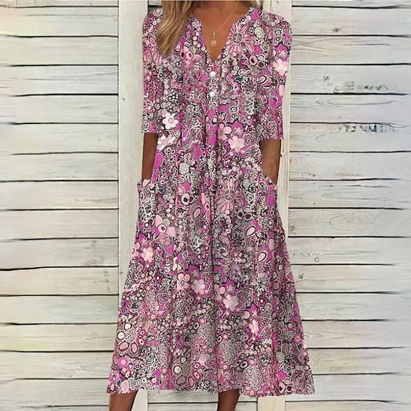 Blommig midiklänning - stilren sommardress med fickor
