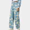 Blå denimbyxor med vida ben och blommönster