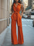 Kvinnors jumpsuit med elegant vida ben i orange - avslappnad stil för varierande tillfällen