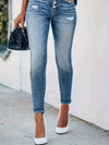 Högmidjade skinnyjeans - eleganta denimbyxor med knapprad
