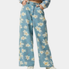 Blå denimbyxor med vida ben och blommönster