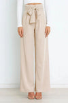Vida byxor - högmidjade byxor med detaljerad rosett för en chic look