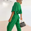 Kvinnors jumpsuit i elegant wrap-stil för kvällsbruk - snygga långa ärmar