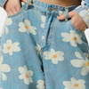 Blå denimbyxor med vida ben och blommönster