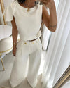 2-delad damset med chic topp och vida byxor - stilfullt crop top-set med unik axeldetalj