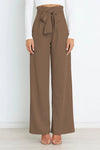 Vida byxor - högmidjade byxor med detaljerad rosett för en chic look