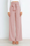 Vida byxor - högmidjade byxor med detaljerad rosett för en chic look