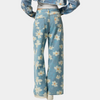Blå denimbyxor med vida ben och blommönster