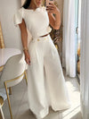 2-delad damset med chic topp och vida byxor - stilfullt crop top-set med unik axeldetalj