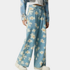 Blå denimbyxor med vida ben och blommönster
